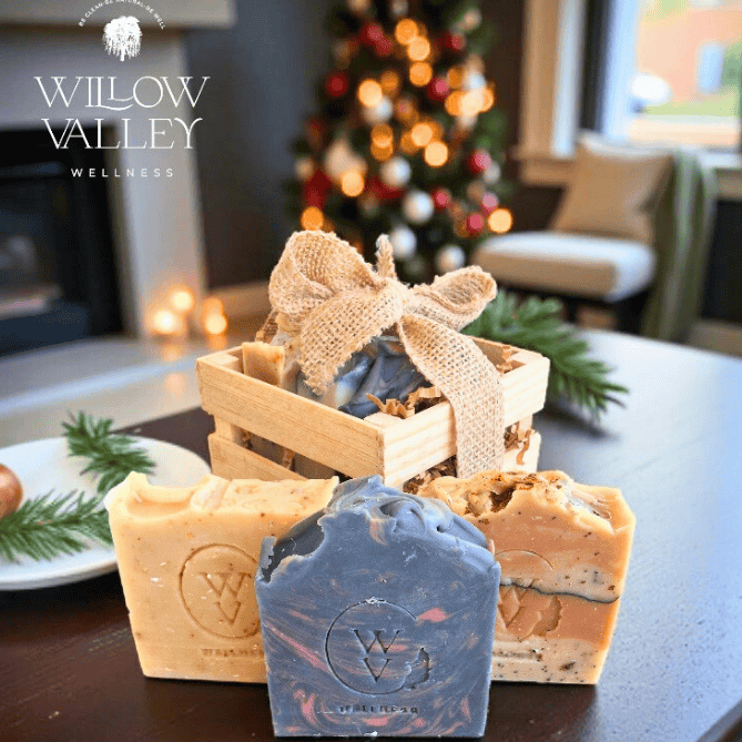 Natural self-care gift set with three handcrafted soaps in a rustic wooden box.