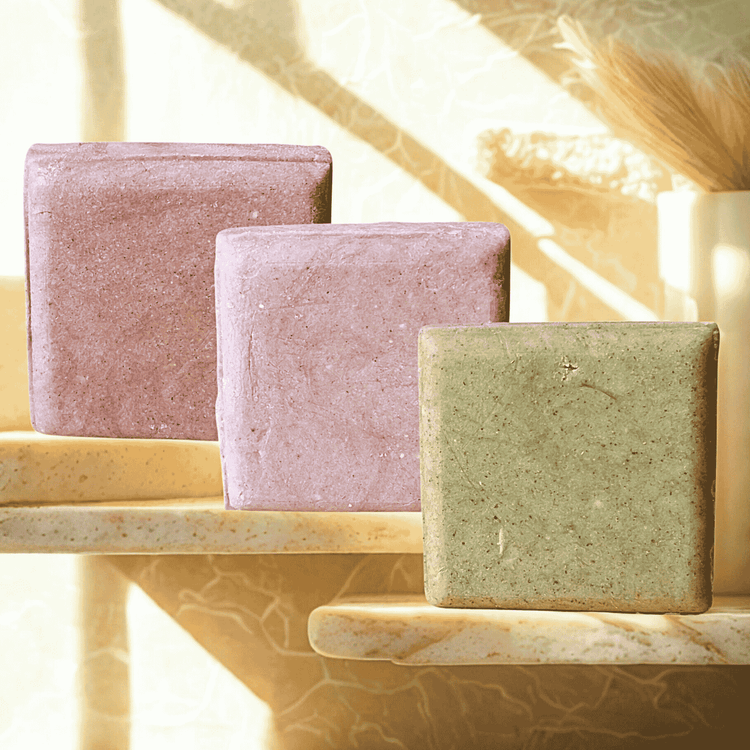 Natural shampoo bars made in Canada displayed together, showing plastic-free, botanical haircare for all scalp types.