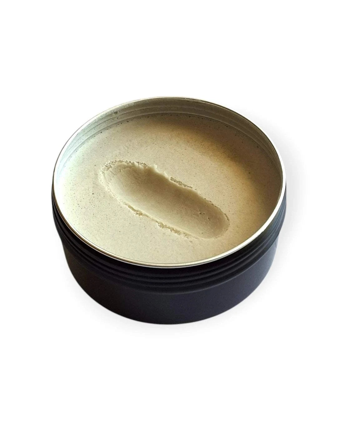 Finger swipe through Willow Valley Wellness natural deodorant paste showing smooth, wax-free texture.