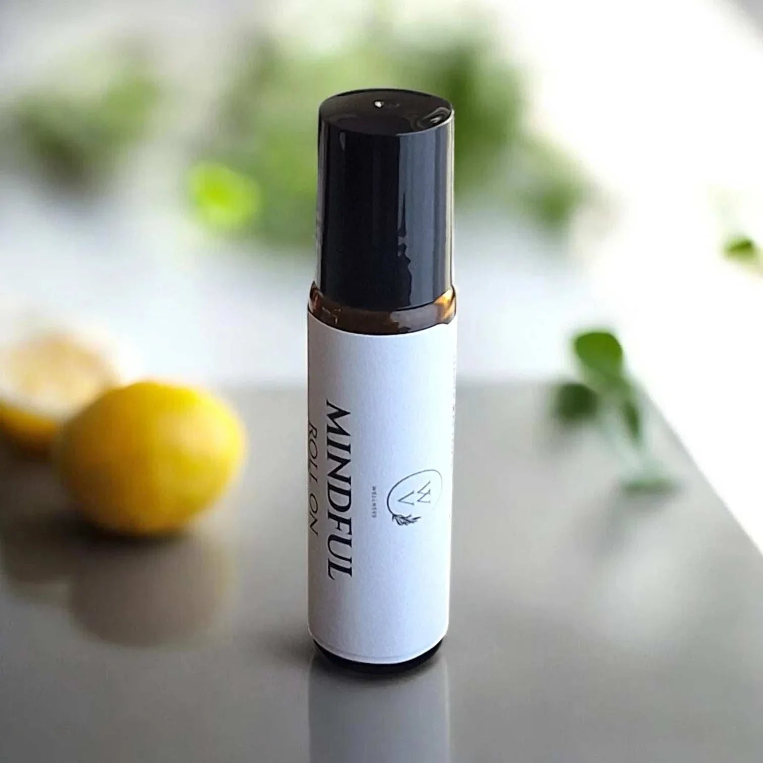 Mindful essential oil roll-on with lavender, clary sage, bergamot, cedarwood, frankincense, and lemon in jojoba oil