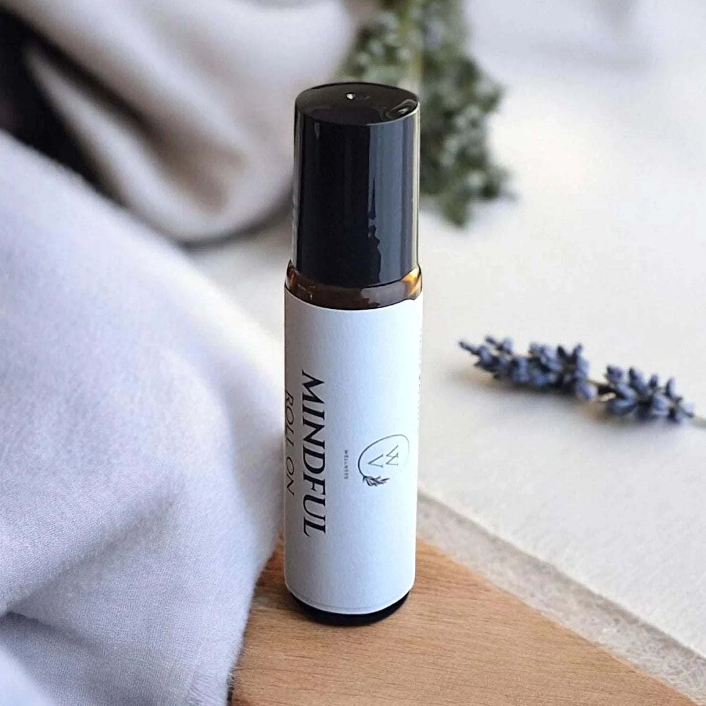 Mindful Roll-On essential oil blend with lavender, bergamot, cedarwood, frankincense, clary sage, and lemon