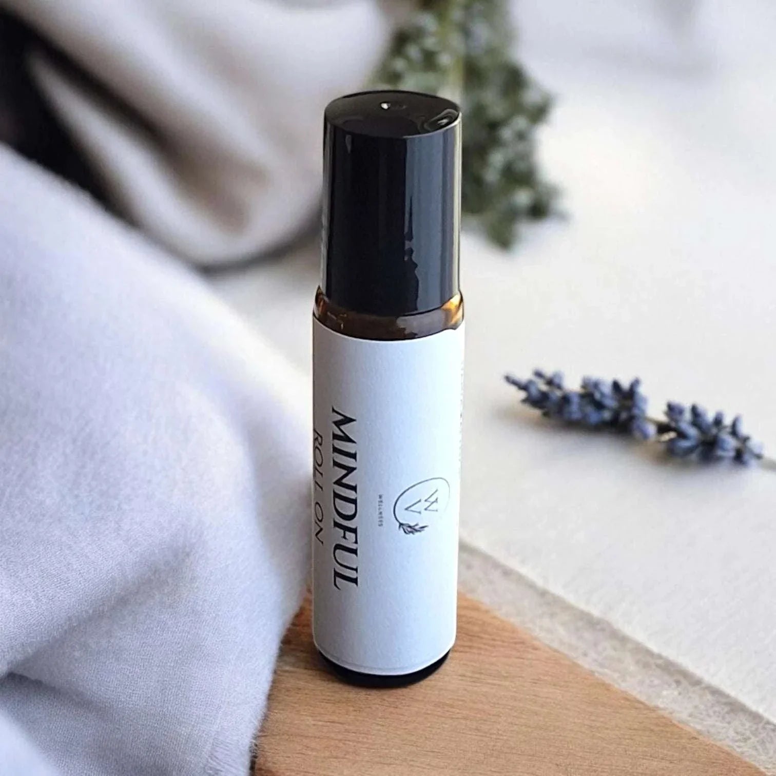 Mindful Roll-On essential oil blend with lavender, bergamot, cedarwood, frankincense, clary sage, and lemon