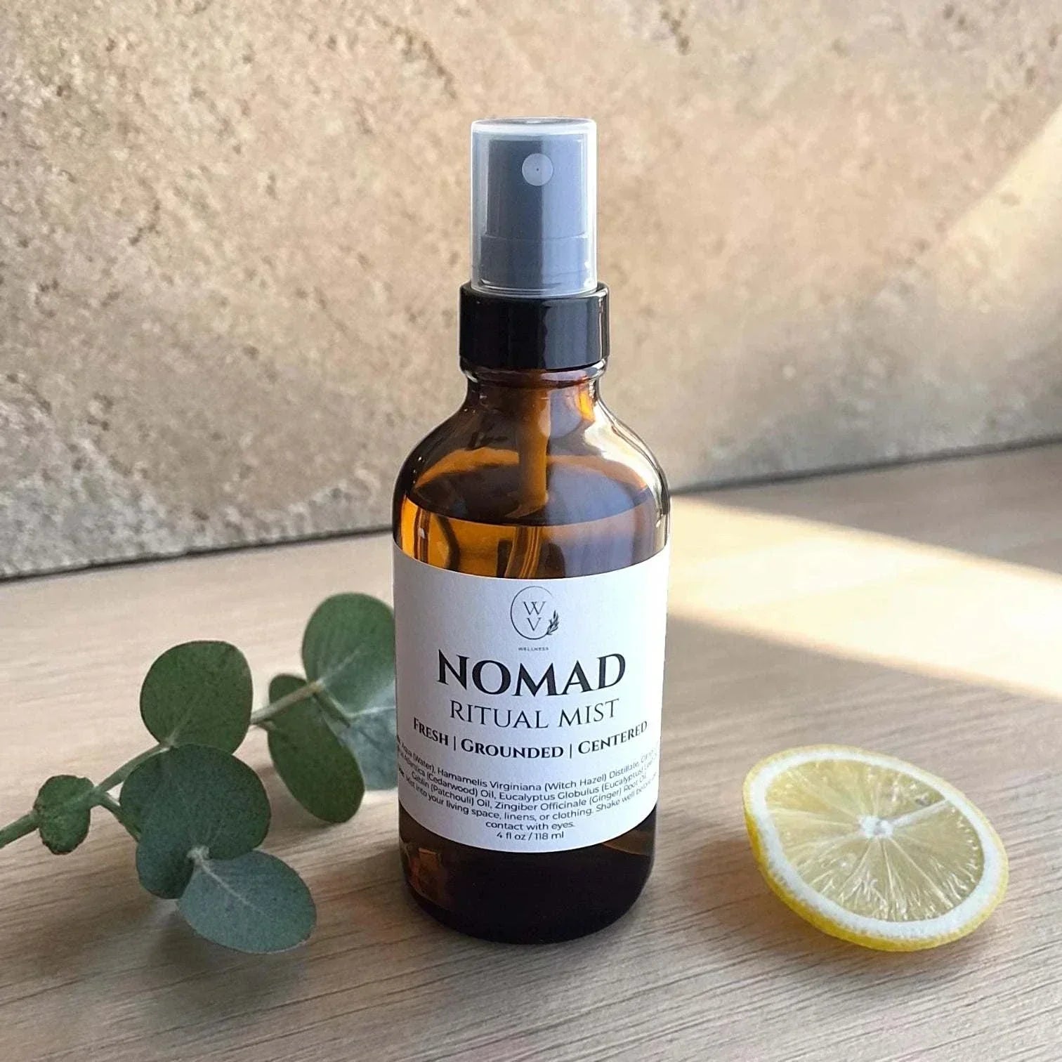 Nomad Ritual Mist wood-spice-citrus essential oil room spray with lemon, cedarwood, eucalyptus, patchouli, and ginger.