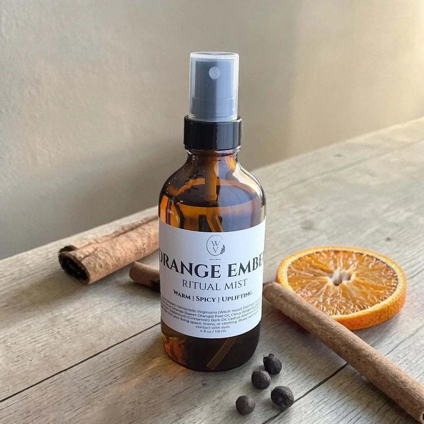 Orange Ember Ritual Mist warm citrus spice essential oil room spray with orange, cinnamon, and clove for a cozy atmosphere.