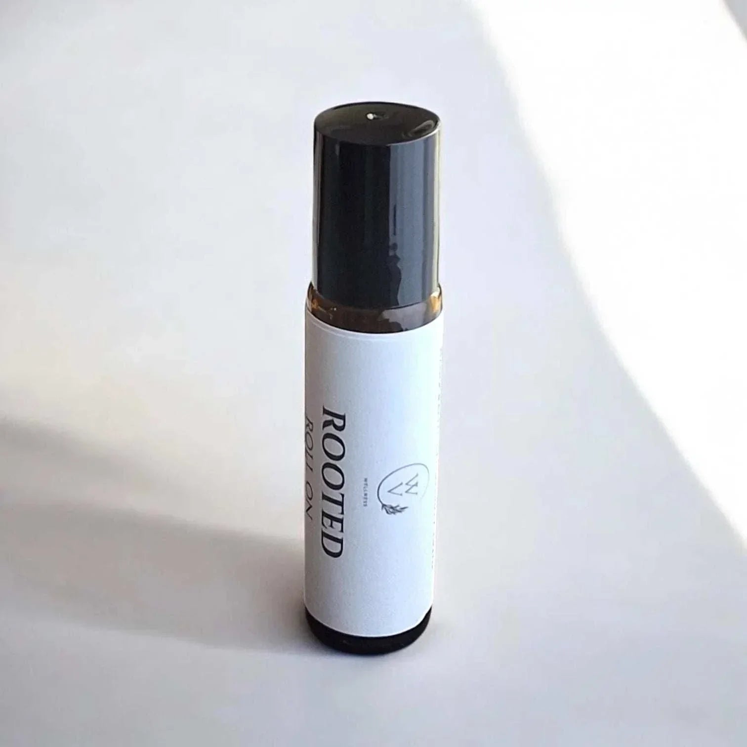 Rooted botanical roll-on with cedarwood, vetiver, patchouli, grapefruit, and black spruce