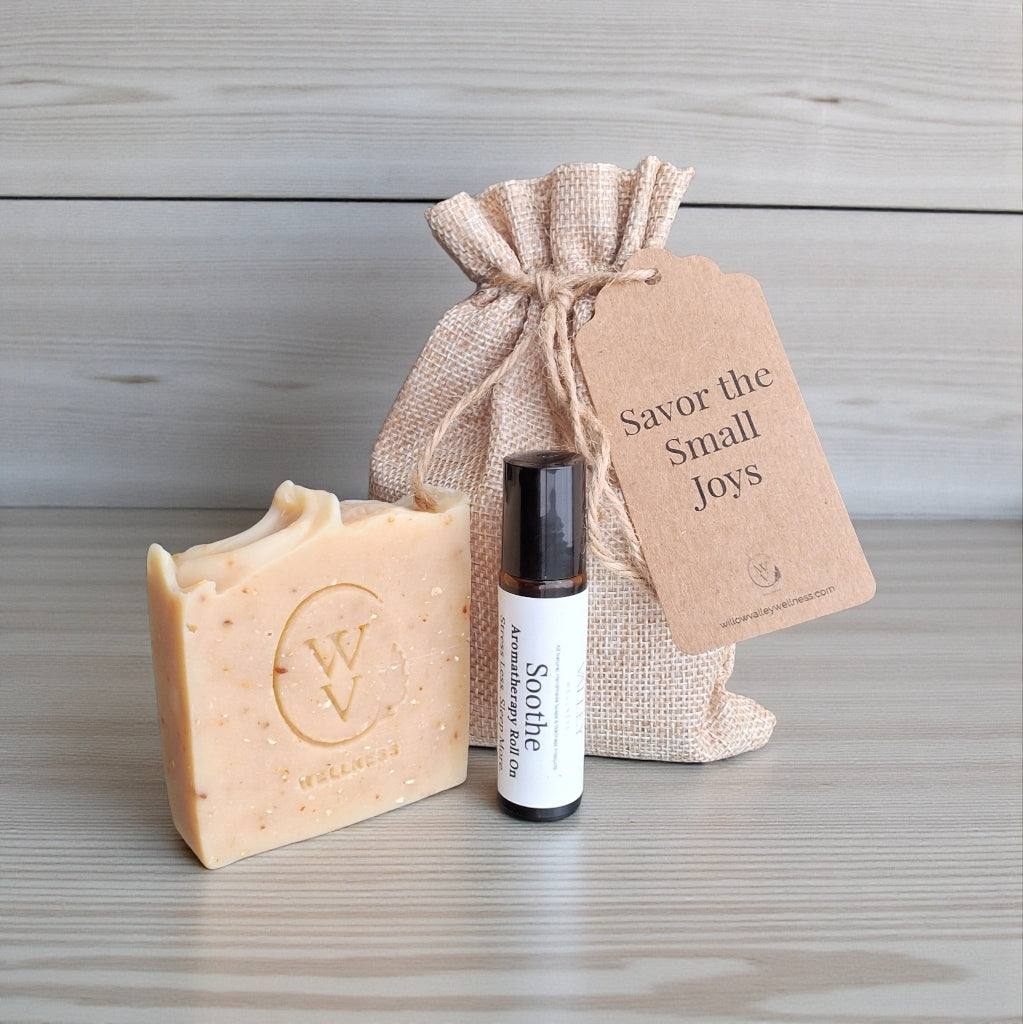 Simple Joy gift set with Honey Oat Lavender soap and Soothe roll-on in a burlap bag with message tag.