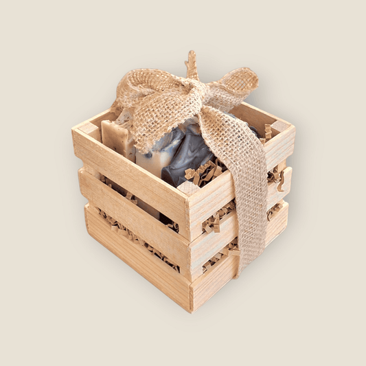 Tranquil Trio natural self-care gift set: three soaps in a wooden box with burlap ribbon and kraft tag.