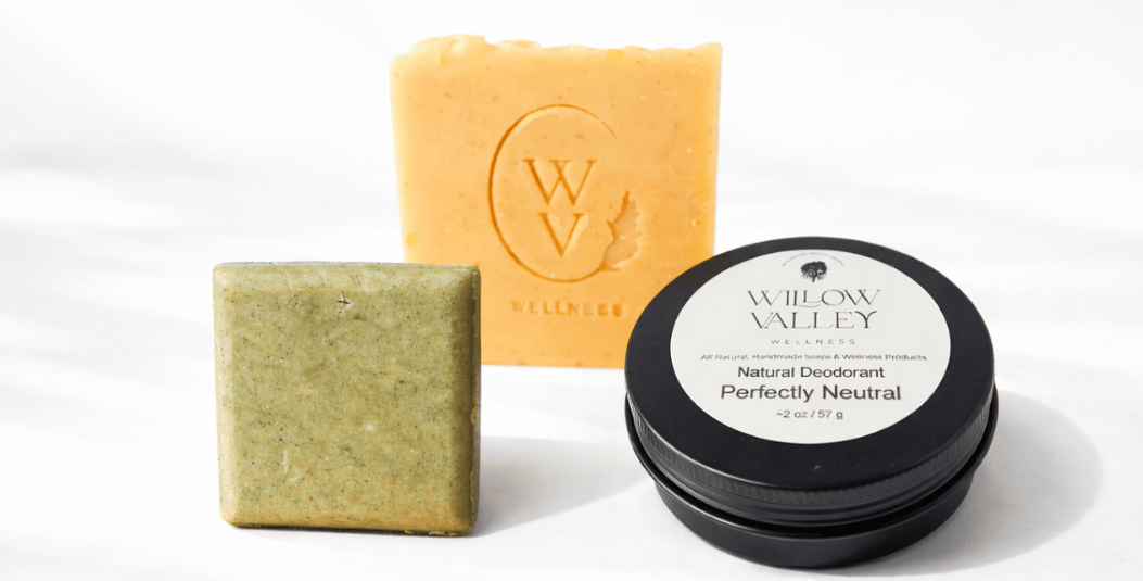 Natural shampoo bar, handcrafted soap, and aluminum-free deodorant displayed on a clean white background.