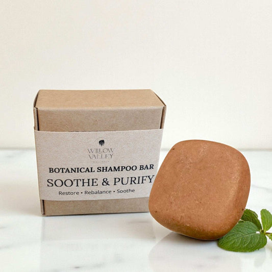 Soothe and Purify Botanical Shampoo Bar in eco-friendly packaging for oily and sensitive scalps