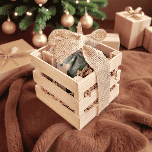 Tranquil Trio natural self-care gift set: three soaps in a wooden box with burlap ribbon and kraft tag.